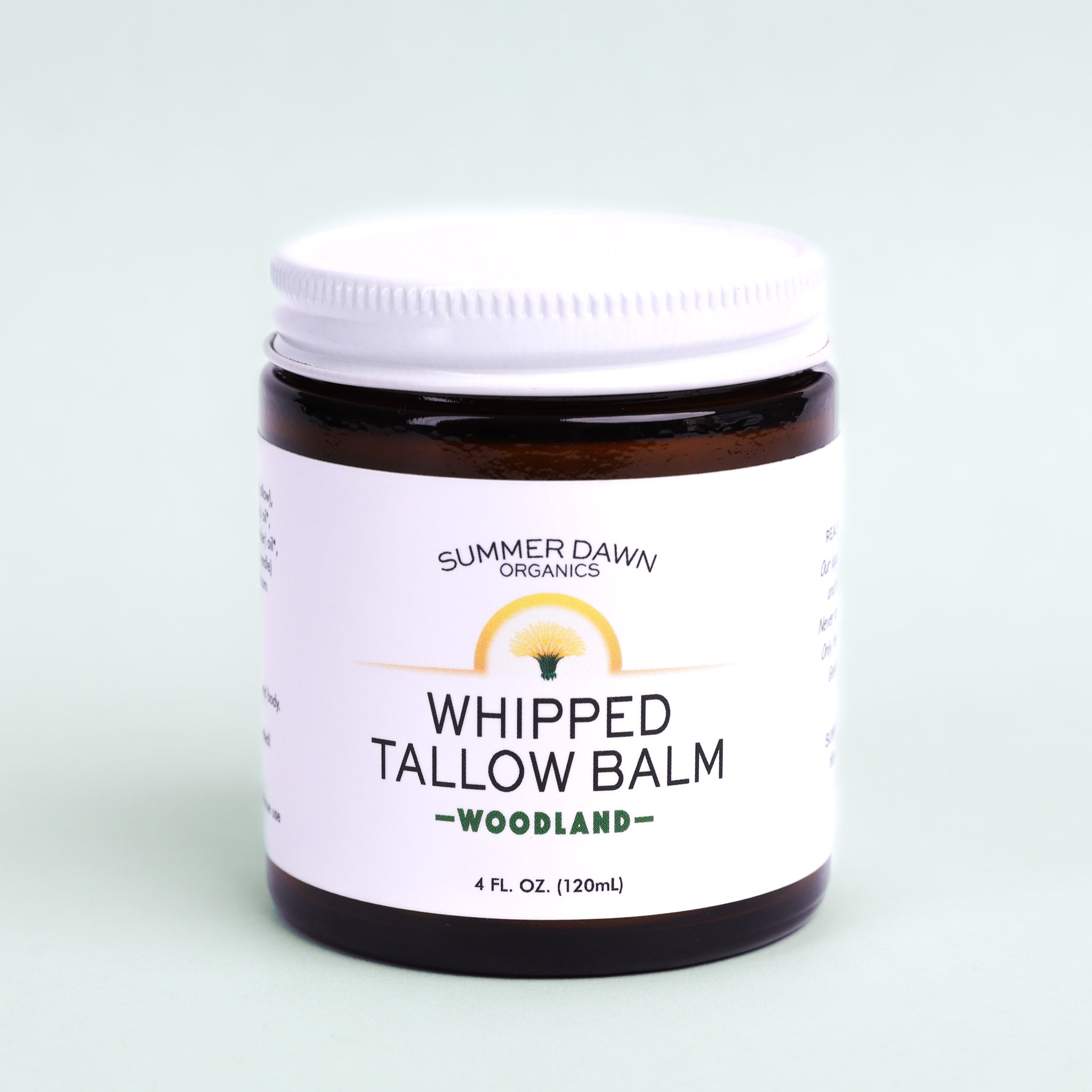 Jar of Summer Dawn Organics Whipped Tallow Balm on a light green background